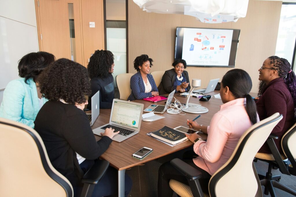 Group meeting in a conference room - Photo by Andrea Piacquadio